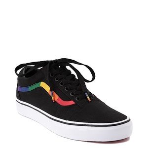 Black skate vans with rainbow stitching on sides.